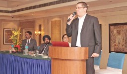 Ran K. Kremer, Director, OptiTex addressing the event while (sitting L to R) Zmirit Roffe, Training Manager; Parvinder Singh, GM; and Rajiv Sud, Sales Manager listen patiently