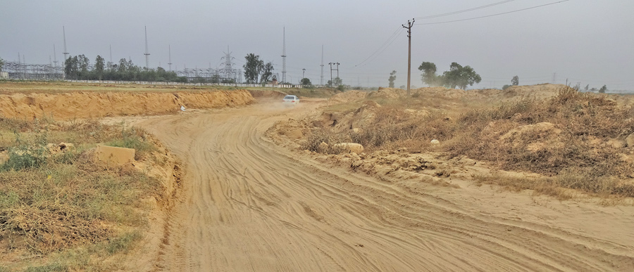 These kinds of bad patches/bad roads are seen on both roads approaching to the village; be it from the Tronica City or Loni town